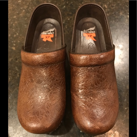 dansko brown tooled leather clogs